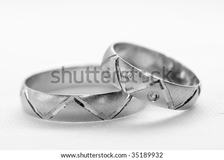 stock photo two silver wedding rings closeup