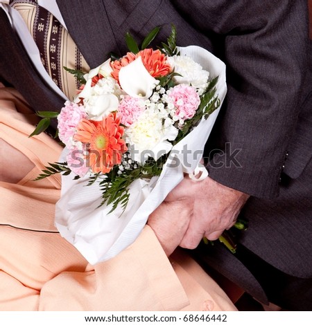 stock photo gold wedding hands with a wedding bouquet
