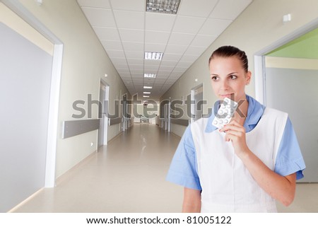 Doctor with pill at hospital
