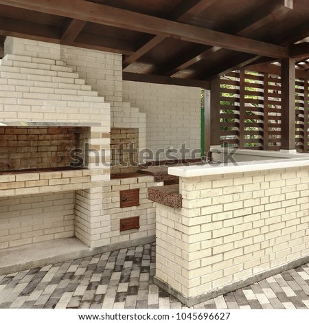 Barbecue Open Fireplace For  Cookout Food. Party Family Place. Outdoor BBQ Grill. Open Summer Kitchen. Barbeque Grill Made From Bricks On The Backyard