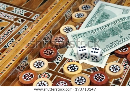 Backgammon Board and two hundred dollar as the prize for winning the game