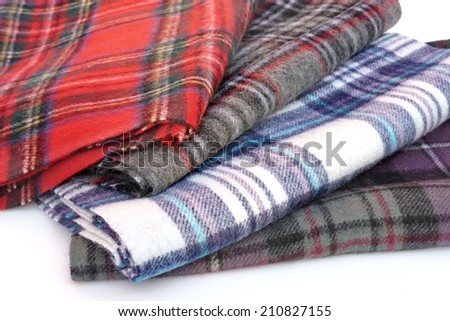 Tartan scarves with fringe. Different styles of color plaid scarves isolated on white background.