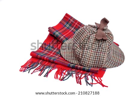 Deerhunter or Sherlock Holmes cap and tartan scarves Isolated on white