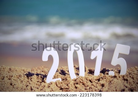 2015 New Year numbers on the sea beach. Background and Texture for text or image