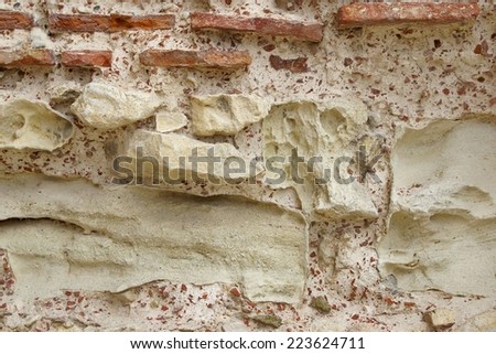 Old Rough Red and White Stone Wall. Background and Texture for text or image. Nesebar. Bulgaria.