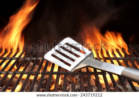 Spatula on the Barbecue Charcoal Fire Grill with Black Background