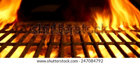 BBQ or Barbecue or Barbeque or Bar-B-Q Charcoal Fire Iron Empty Grill with Flames Isolated on Black Background