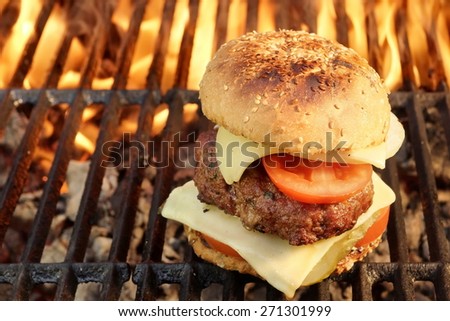 Homemade BBQ Beef Burger On The Hot Flaming Grill. Good Snack For Outdoors Summer Party Or Picnic