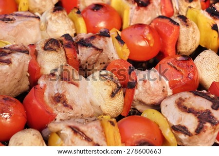 Assorted Meat And Vegetables Kebabs On The Hot BBQ Grill Background Close-up