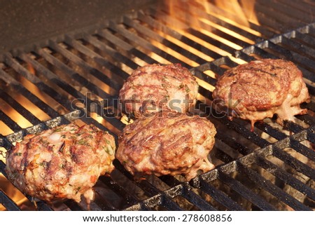 Minced Beef Pork Mutton Burgers On The Hot BBQ Grill Background Closeup. Good Snack For Outdoor Summer Barbecue Party Or Picnic
