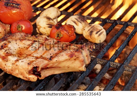 BBQ Pork Rib Pepper Steak, Tomato And Mushrooms On The Hot Flaming Charcoal Grill
