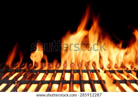 Hot Empty Clean Charcoal BBQ Grill With Vibrant Flames On The Black Background. Cookout Concept.