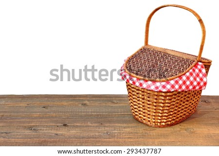 Picnic Wicker Basket Or Hamper On The Outdoor Wood Table Isolated On White Background Close-up