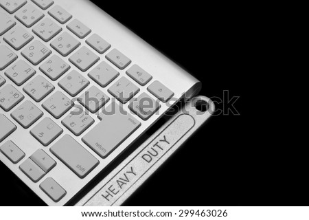 Chrome Plated Wrench With Sign Heavy Duty And  Wireless Keyboard Isolated On Black  Background. Remote Assistance Or Technical Support Or Repair Service Business  Concept
