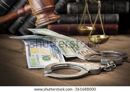 Concept For Corruption, Bankruptcy Court, Bail, Crime, Bribing, Fraud, Judges Gavel, Soundboard And Bundle Of Dollar Cash On The Rough Wooden Textured Table Background.