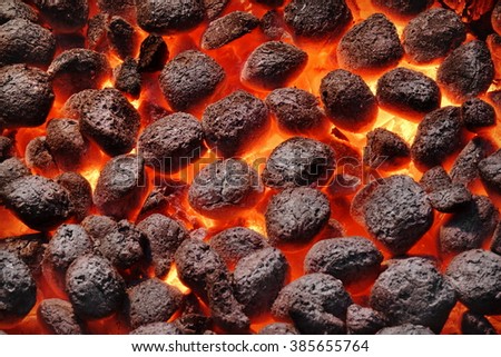 BBQ Grill Pit With Glowing And Flaming Hot Charcoal Briquettes, Food Background Or Texture, Close-Up, Top View