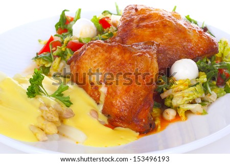 Chicken leg with salad and asparagus