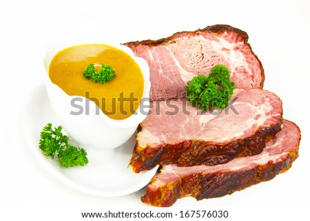 Smoked pork chop and sauce in gravy boat