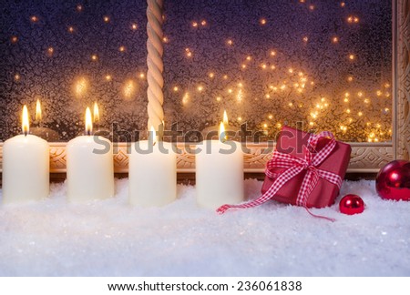 Gift and candles in the window