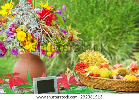 Autumn flowers, fall decoration with slate