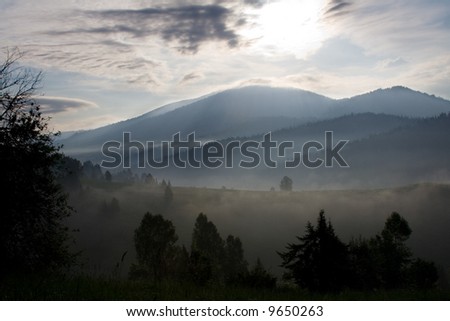 Unusual foggy morning in mountains of the western Siberia