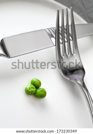 Three small peas on a plate