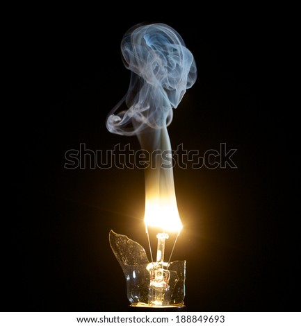 Light blue smoke rising from light bulb fire