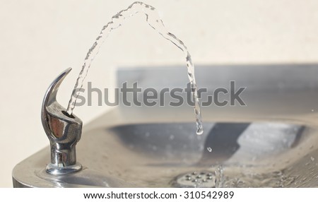 Water streaming from drinking fountain