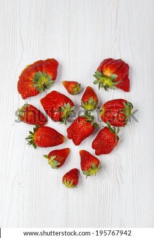 fresh strawberries heart shape. Funny red fruit.  heart