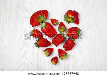 fresh strawberries heart shape. Funny red fruit.  heart
