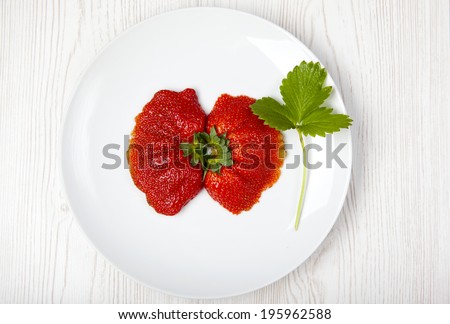fresh strawberries strange shape. Funny red fruit