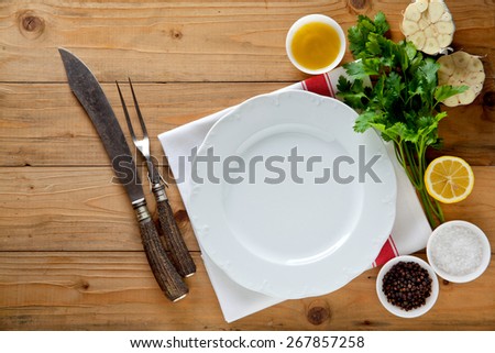 empty plate and carving knife and fork