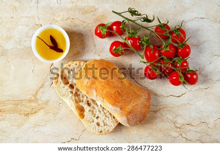 cherry tomatoes. olive oil and fresh bread
