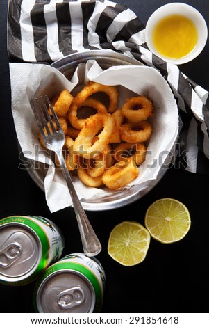 just fried squid rings. roast  seafood snack. beer in an iron pot