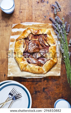 Healthy open apple pie with lavender. and almond milk . French cuisine on wood