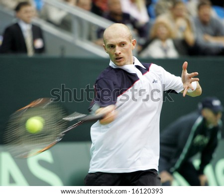 MOSCOW - DECEMBER 1: Nikolay Davydenko, Russian tennis player, returns the ball at the Davis Cup December 1, 2006 in Moscow, Russia.