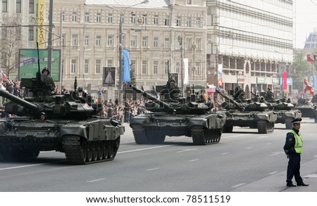 MOSCOW - MAY 9: Russian Army heavy tanks roll down Moscow streets during the Victory Day military parade May 9, 2011 in Moscow, Russia.