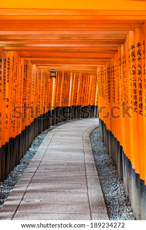 KYOTO, JAPAN - MAY 21 :  Tori gates at the Fushimi Inari shrine in Kyoto, Japan on May 21, 2013. Fushimi Inari Shrine is one of 17 UNESCO World Heritage sites in Kyoto.