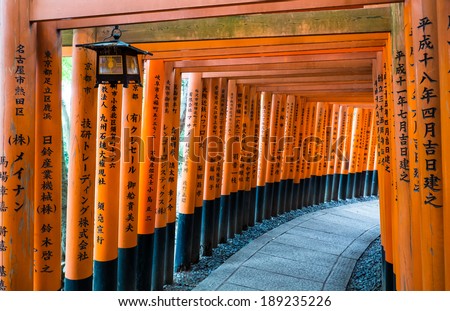 KYOTO, JAPAN - MAY 21 :  Tori gates at the Fushimi Inari shrine in Kyoto, Japan on May 21, 2013. Fushimi Inari Shrine is one of 17 UNESCO World Heritage sites in Kyoto.