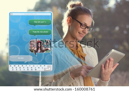 Concept of using wireless technology by woman, video call, typing message on tablet. Incoming call. interface of tablet pc screen