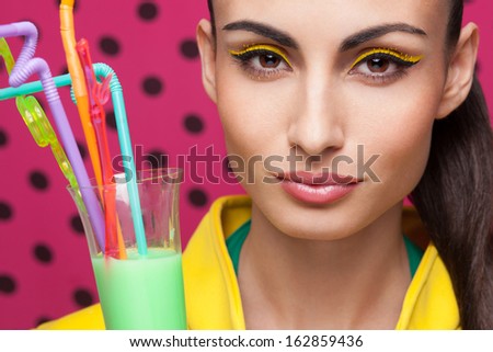 Colorful Closeup of beautiful model with cocktail