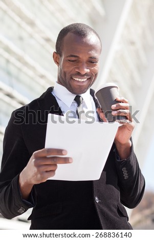 black businessman drinking coffee during a lunch