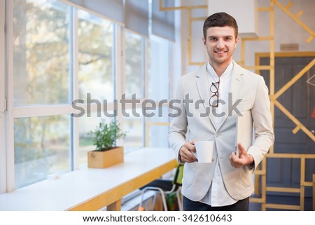 Happy worker in workplace