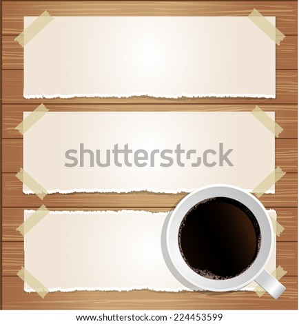 paper labels attached with sticky tape and coffee cup on wood background