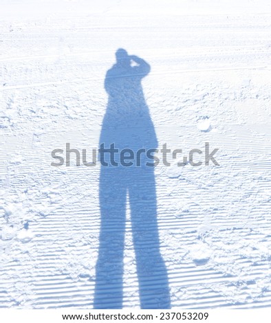 Shadow of man in the snow