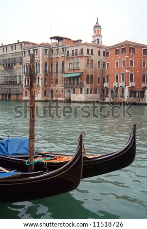 Gondolas in foreground with classical venetian architecture in backround, Venice Italy