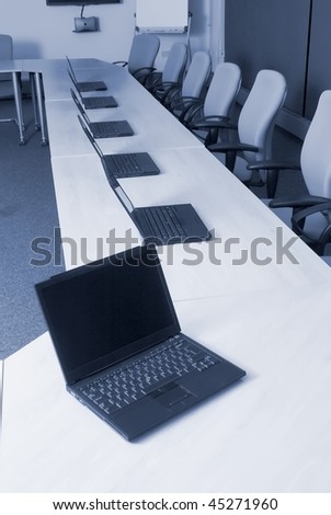 Laptop, white board, video conference equipment in college training room