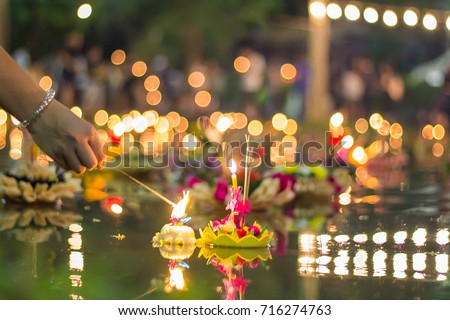 People float lanterns in the river to worship river goddess in Loy Kratong festival.