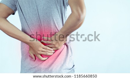 man suffering from backache,Lower back pain.