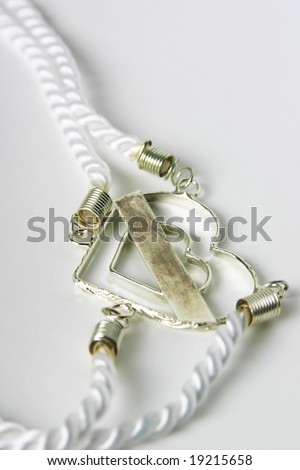 stock photo Vertical image of cord used in Catholic wedding